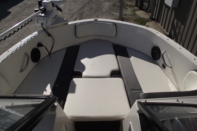 Slide: The Image of 2022 Bayliner VR4 Bowrider OB interior with cushioned seating and modern design. - 6