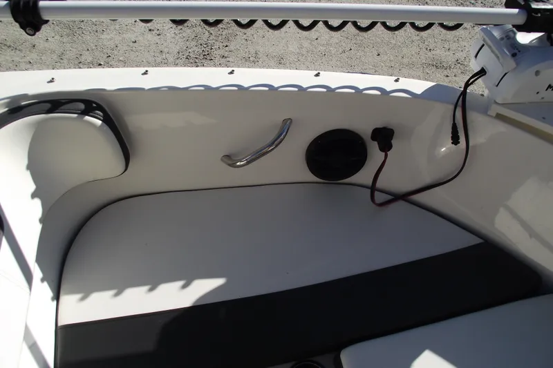 Slide: The Image of 2022 Bayliner VR4 Bowrider OB interior with seating and control panel. - 8