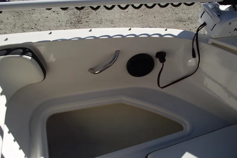 Slide: The Image of 2022 Bayliner VR4 Bowrider OB interior detail with storage compartment and wiring. - 9