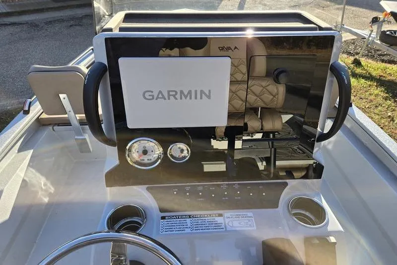 Slide: The Image of Avid 21 Fusion 2026 boat dashboard with Garmin display and controls. - 10