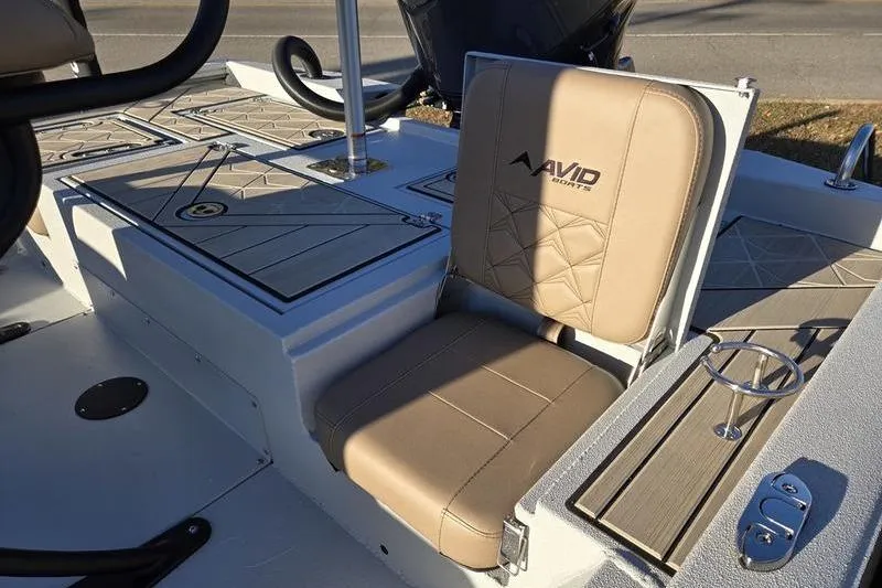 Slide: The Image of Avid 21 Fusion 2026 boat seat with beige upholstery and modern design. - 6