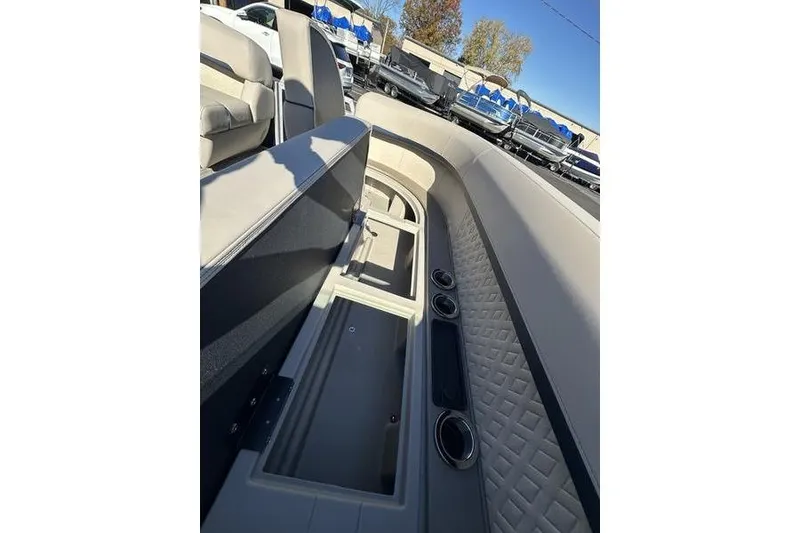 Slide: The Image of 2026 Bennington M Swingback 24 MSB pontoon boat interior with luxurious seating and table. - 10