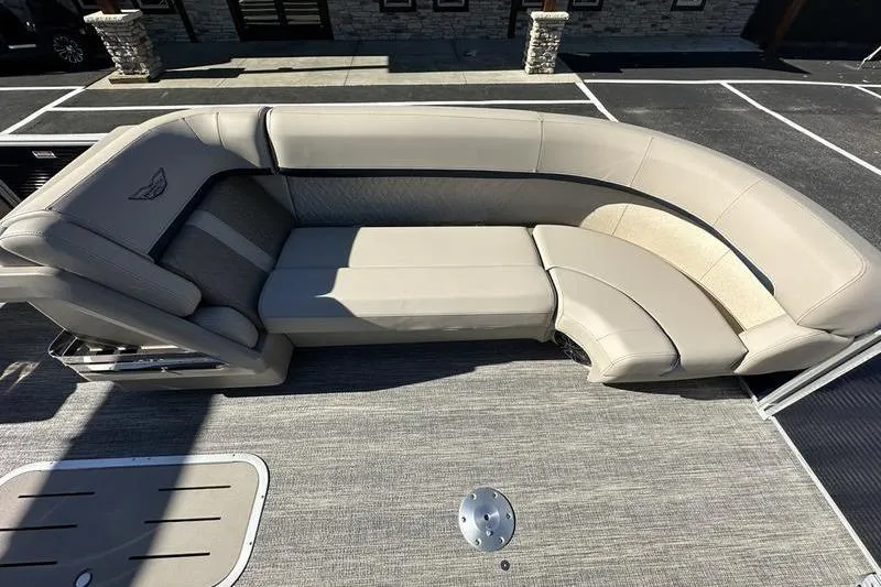 Slide: The Image of 2026 Bennington M Swingback 24 MSB interior with open storage compartments and seating. - 14