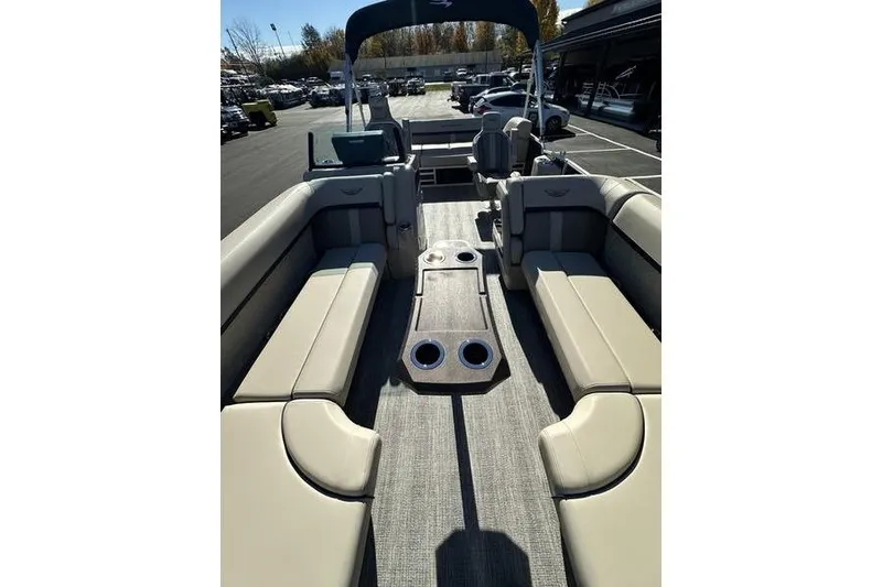 Slide: The Image of 2026 Bennington M Swingback 24 MSB boat interior with modern steering and dashboard controls. - 15