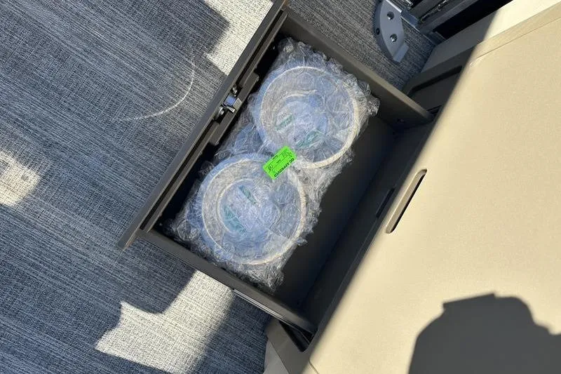 Slide: The Image of 2026 Bennington M Swingback 24 MSB pontoon boat with luxurious seating and modern design. - 18