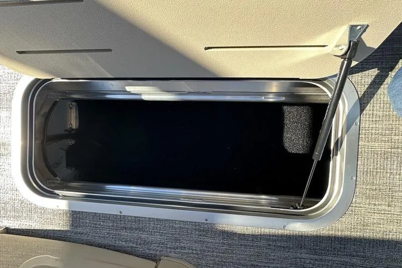 Slide: The Image of 2026 Bennington M Swingback 24 MSB dashboard with control panel and cup holder. - 20