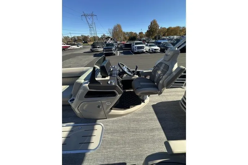 Slide: The Image of Control panel of 2026 Bennington M Swingback 24 MSB with cup holder and buttons. - 21