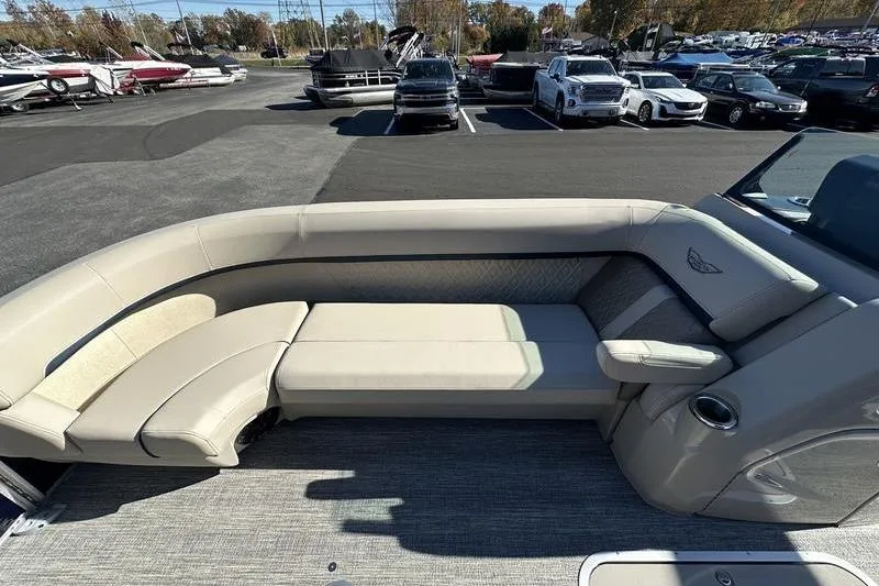 Slide: The Image of 2026 Bennington M Swingback 24 MSB pontoon boat with luxurious beige seating. - 9
