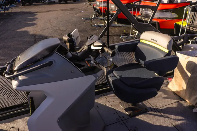 Slide: The Image of 2025 Sea-Doo Switch Cruise Limited 21 cockpit with steering and seating features. - 15