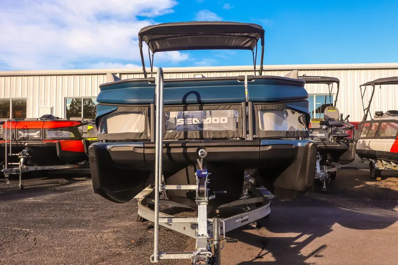 Slide: The Image of 2025 Sea-Doo Switch Cruise Limited 21 pontoon boat on trailer, outdoor display. - 6