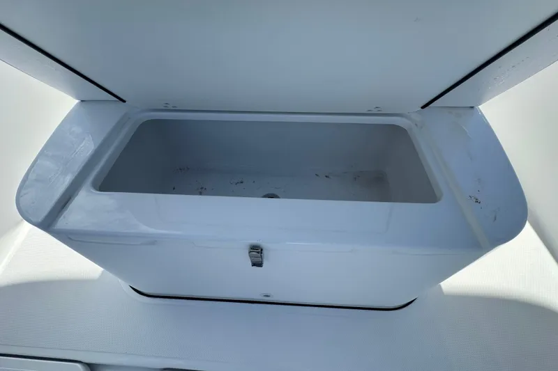 Slide: The Image of Open storage compartment on 2026 Bluewater 25t boat, featuring a sleek white design. - 13