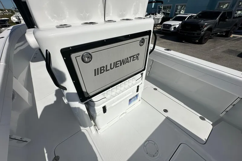 Slide: The Image of 2026 Bluewater 25t boat interior with branded storage compartment and sleek white design. - 18