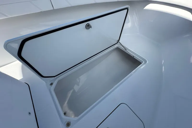 Slide: The Image of Open storage compartment on 2026 Bluewater 25t boat, showcasing sleek design and functionality. - 9