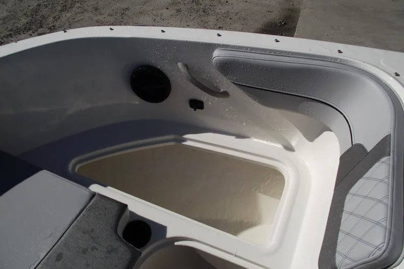 Slide: The Image of 2026 Bayliner VR4 Bowrider OB interior with seating and storage area. - 12