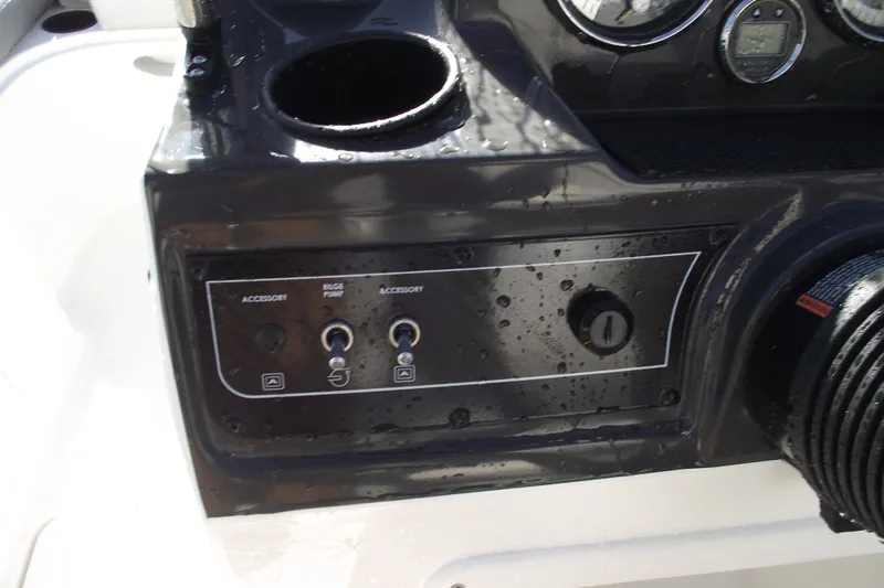 Slide: The Image of Control panel of 2026 Bayliner VR4 Bowrider OB with accessory switches and bilge pump. - 14