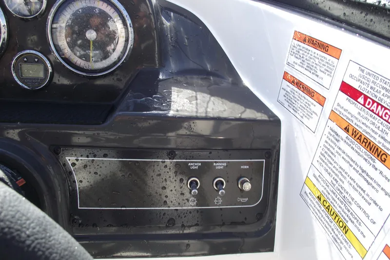 Slide: The Image of 2026 Bayliner VR4 Bowrider OB dashboard with gauges and warning labels. - 15