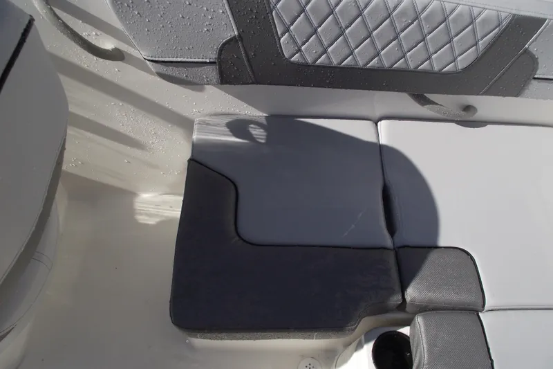 Slide: The Image of 2026 Bayliner VR4 Bowrider OB interior seating with quilted upholstery and modern design. - 26