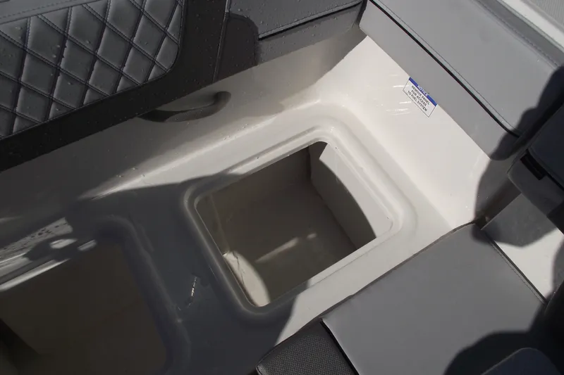 Slide: The Image of 2026 Bayliner VR4 Bowrider OB storage compartment with quilted seat detail. - 34