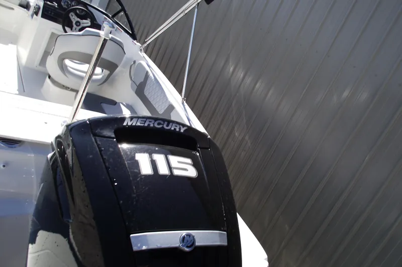 Slide: The Image of 2026 Bayliner VR4 Bowrider OB with Mercury 115 outboard engine, interior view. - 4