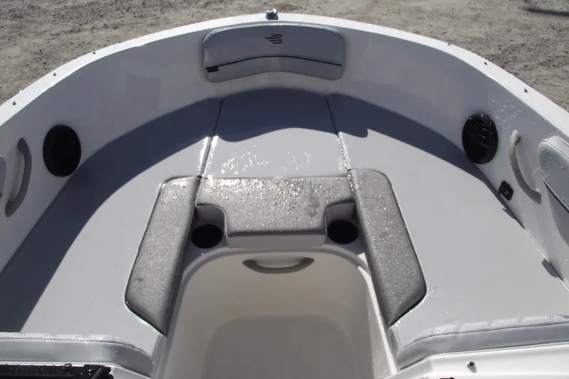 Slide: The Image of 2026 Bayliner VR4 Bowrider OB interior with cushioned seating and cup holders. - 6