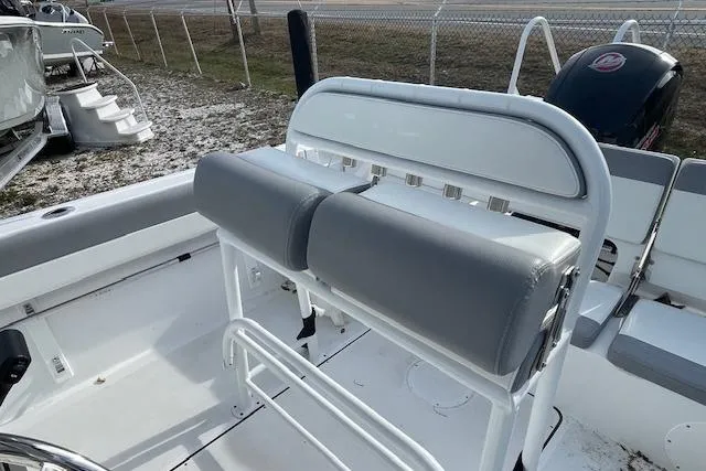Slide: The Image of 2021 Release 210 RX boat interior with gray seating and white railing. - 14