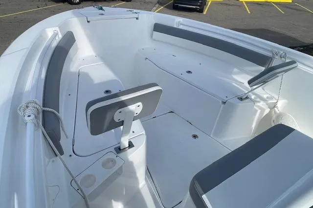 Slide: The Image of 2021 Release 210 RX boat interior with seating and storage compartments. - 17