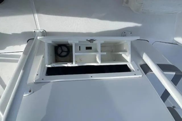 Slide: The Image of Open storage compartment on 2021 Release 210 RX boat deck. - 20