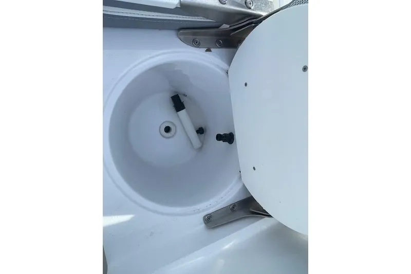 Slide: The Image of Open compartment in 2021 Release 210 RX boat, showing interior details. - 24