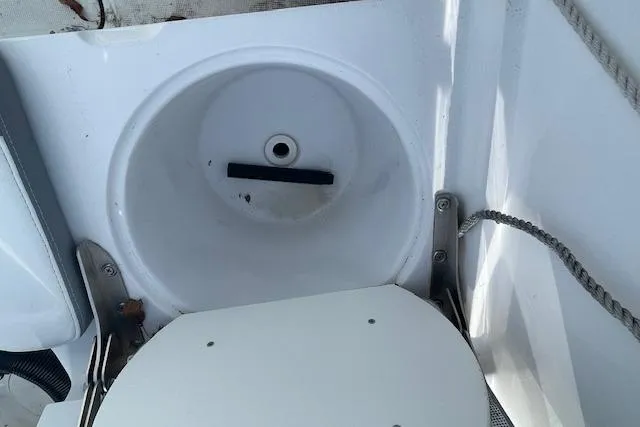 Slide: The Image of 2021 Release 210 RX boat interior with circular compartment and rope detail. - 25