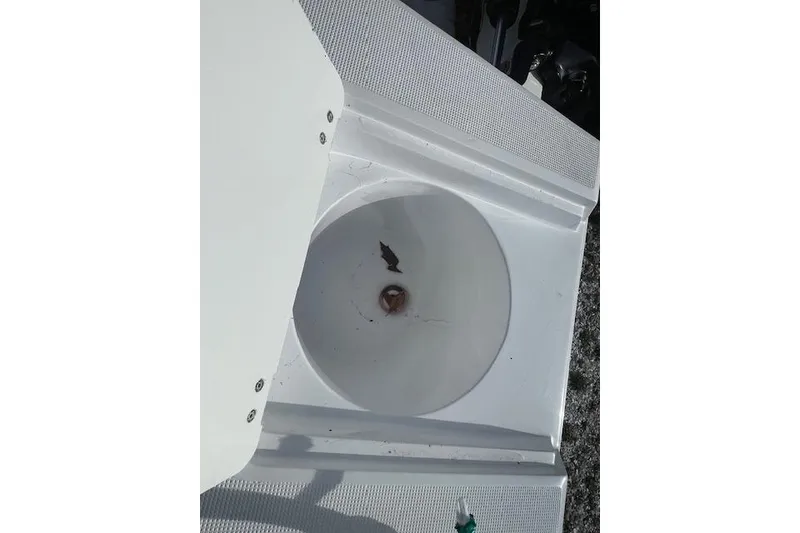 Slide: The Image of White compartment of 2021 Release 210 RX boat, featuring a circular basin. - 26