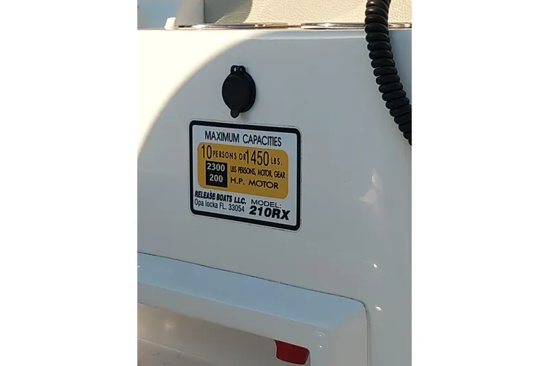 Slide: The Image of 2021 Release 210 RX boat capacity label, 10 persons or 1450 lbs, 200 HP motor. - 28