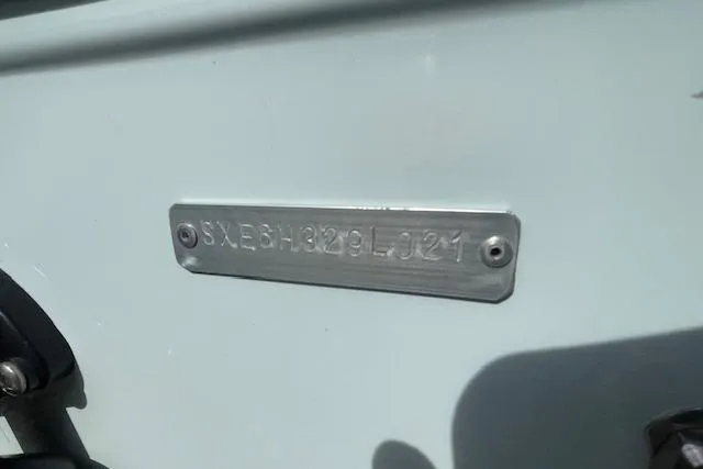 Slide: The Image of Metal identification plate on a 2021 Release 210 RX boat. - 29