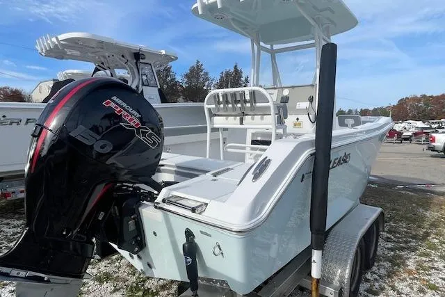 Slide: The Image of 2021 Release 210 RX boat with powerful outboard motor on trailer. - 5