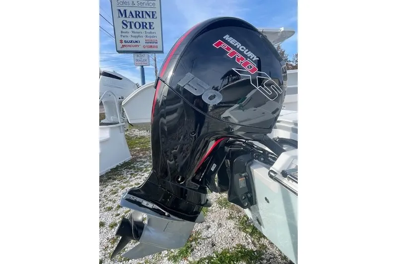 Slide: The Image of Mercury Pro XS 150 outboard motor on Release 210 RX, 2021 model, at marine store. - 9