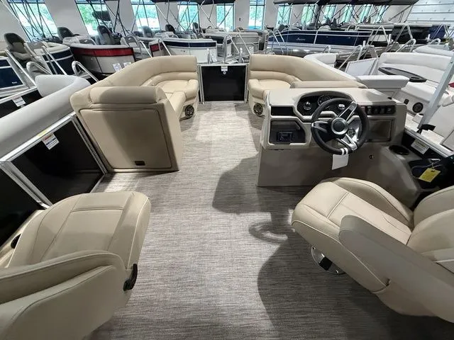 Slide: The Image of Interior of 2026 Godfrey Pontoons Xperience 2286 SBX, featuring beige seating and modern helm. - 10