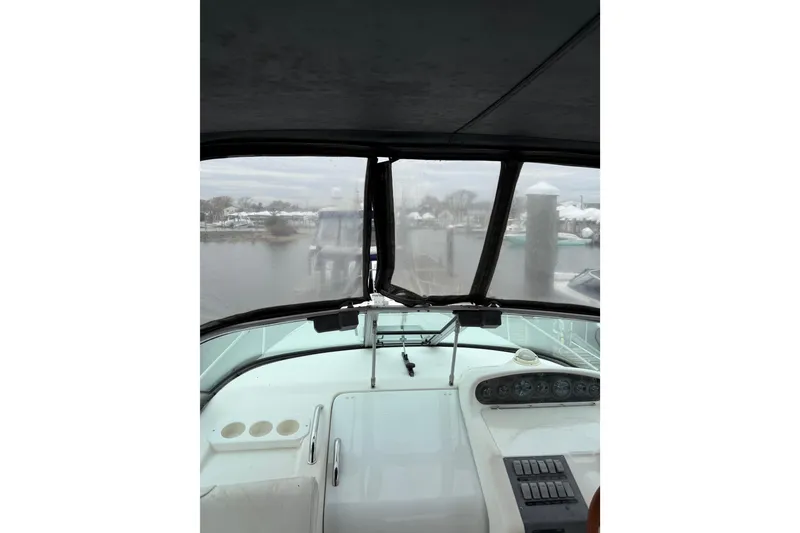 Slide: The Image of Interior view from 1996 Sea Ray 270 Sundancer boat, overlooking marina through windshield. - 12
