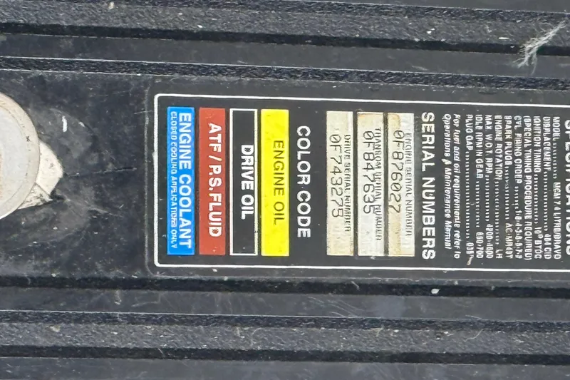 Slide: The Image of Label on 1996 Sea Ray 270 Sundancer showing fluid types and serial numbers. - 14