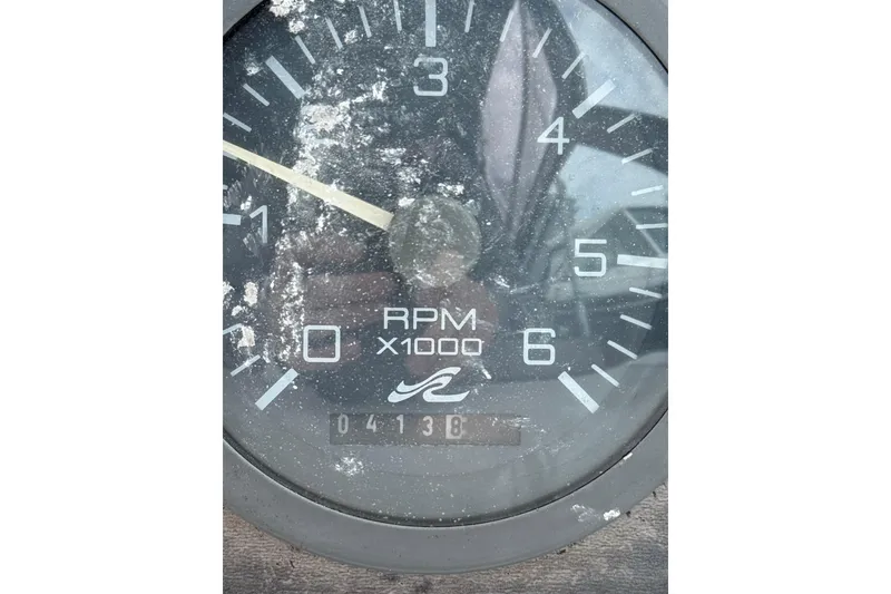 Slide: The Image of Close-up of a 1996 Sea Ray 270 Sundancer RPM gauge, showing 4138 hours. - 23