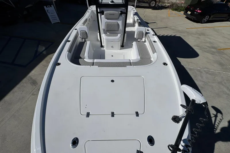 Slide: The Image of 2026 Caymas 28 HB boat deck with seating and storage compartments. - 22