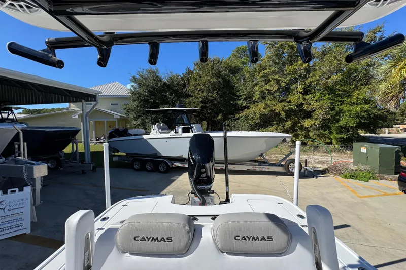 Slide: The Image of 2026 Caymas 28 HB boat at marina, featuring sleek design and modern amenities. - 29