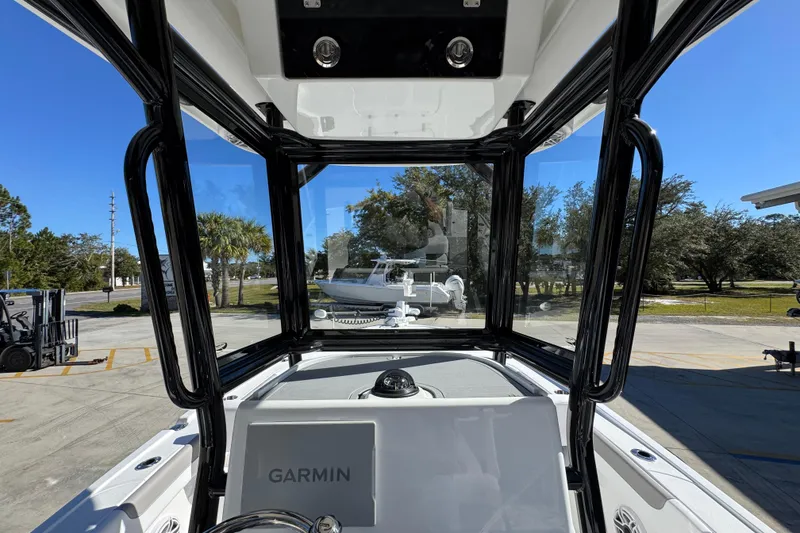 Slide: The Image of Interior view of 2026 Caymas 28 HB boat with Garmin navigation system. - 32