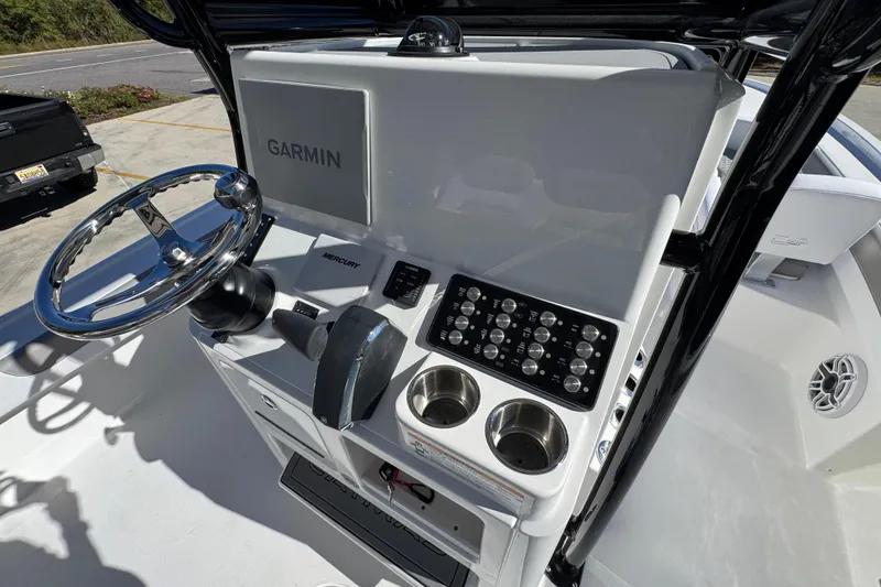 Slide: The Image of 2026 Caymas 28 HB boat console with Garmin display and Mercury controls. - 33