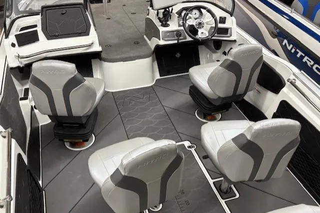 Slide: The Image of 2026 Nitro ZV20 Sport Pro boat interior with four gray seats and modern dashboard. - 10