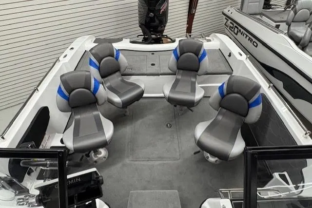 Slide: The Image of Interior of 2026 Nitro ZV19 Pro boat with five gray and blue seats. - 13