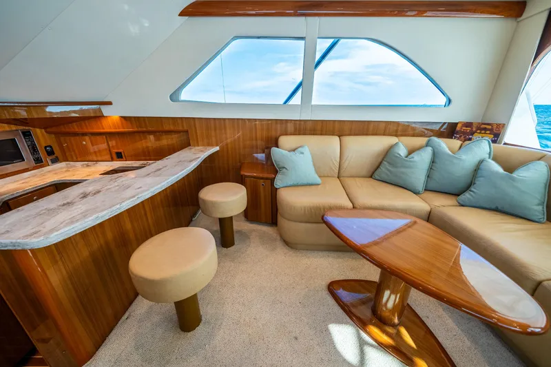 Slide: The Image of Luxurious interior of 2008 Viking 42 Convertible yacht with plush seating and elegant wood finishes. - 30
