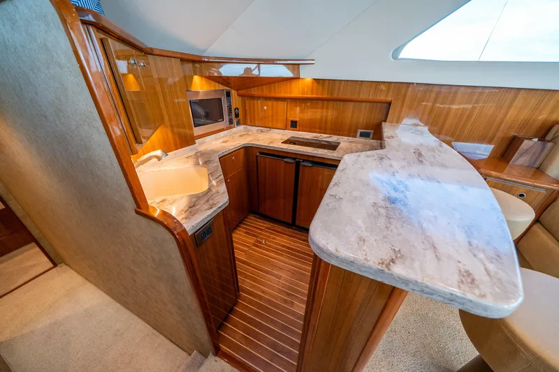 Slide: The Image of Luxurious kitchen interior of 2008 Viking 42 Convertible yacht with modern amenities. - 34