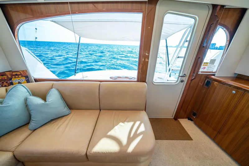 Slide: The Image of Interior of 2008 Viking 42 Convertible yacht with ocean view through window. - 37