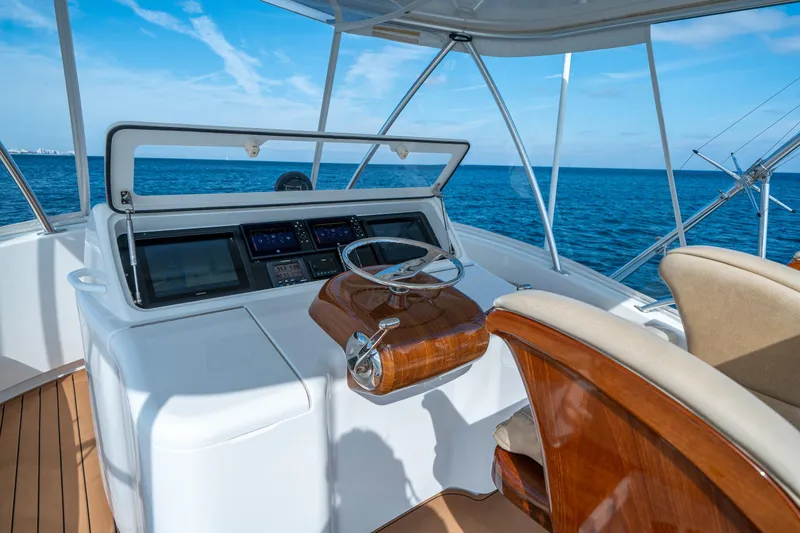 Slide: The Image of 2008 Viking 42 Convertible yacht helm with ocean view and modern controls. - 56