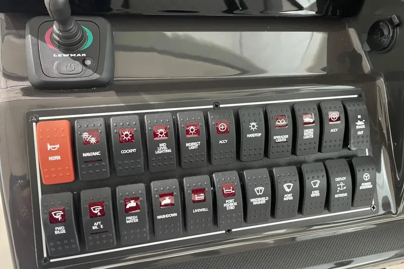 Slide: The Image of 2024 Pursuit DC 326 Dual Console boat in storage, showcasing sleek design and modern features. - 10