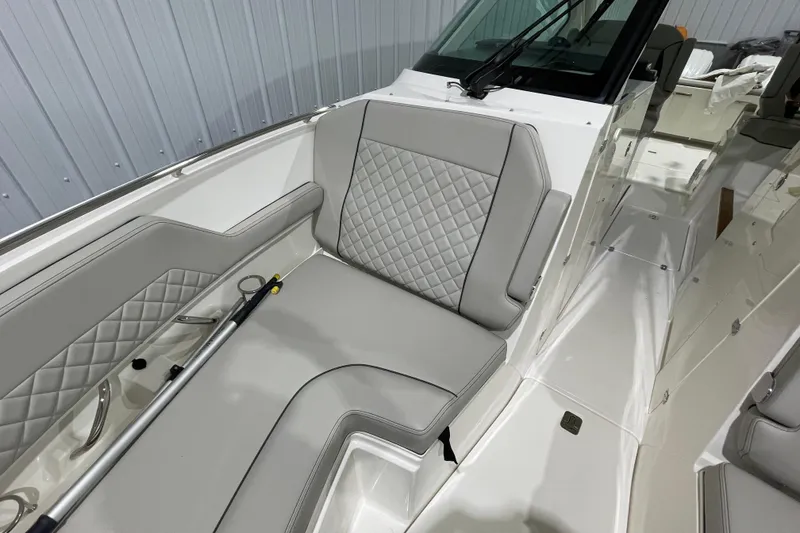 Slide: The Image of Throttle controls of 2024 Pursuit DC 326 Dual Console boat, featuring ergonomic design. - 16
